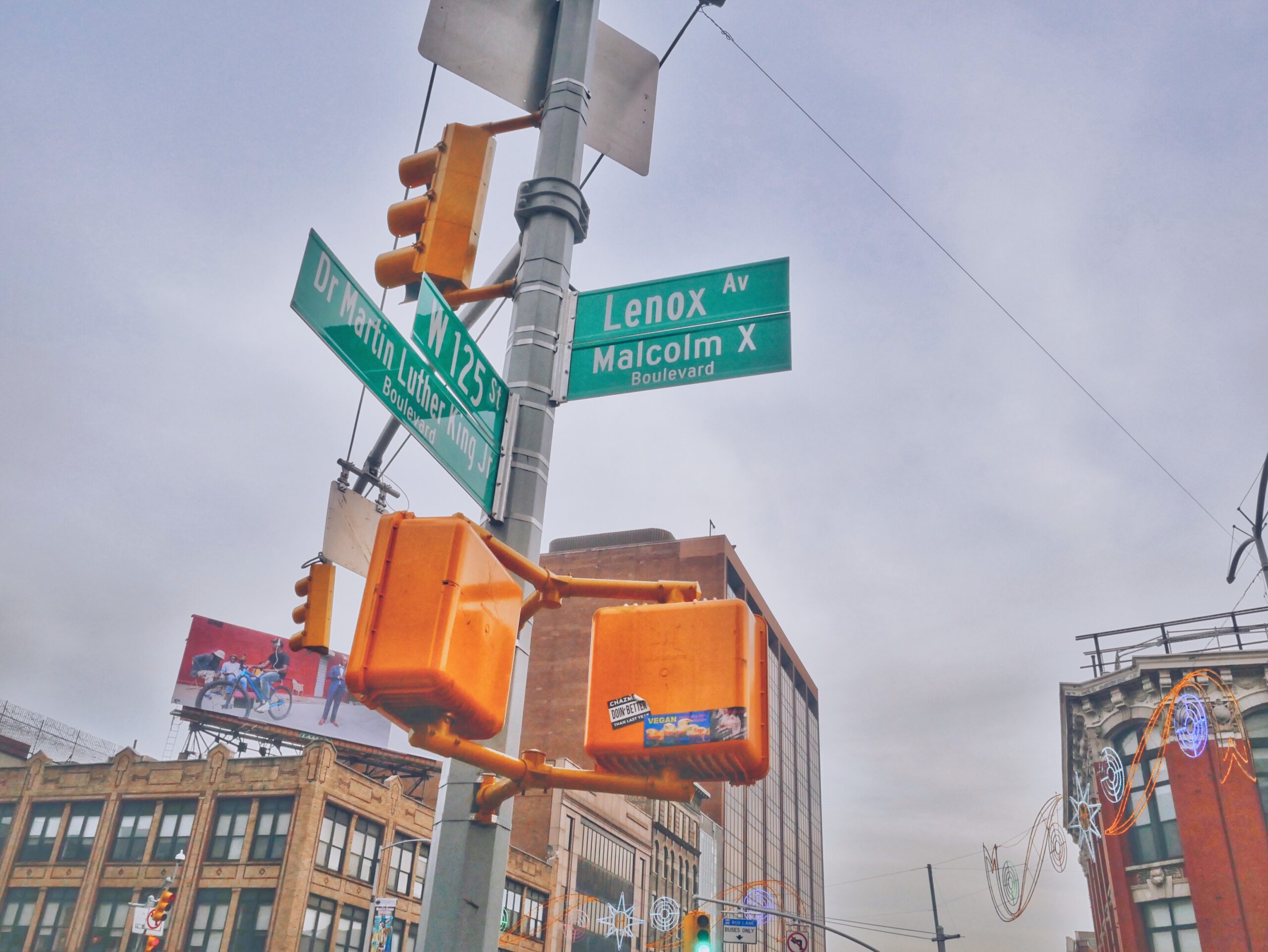 Harlem, New York is a popular place for tourists to visit. Learn more about the best ways to get around and the safety level. 
pictured: the street sign of central Harlem 