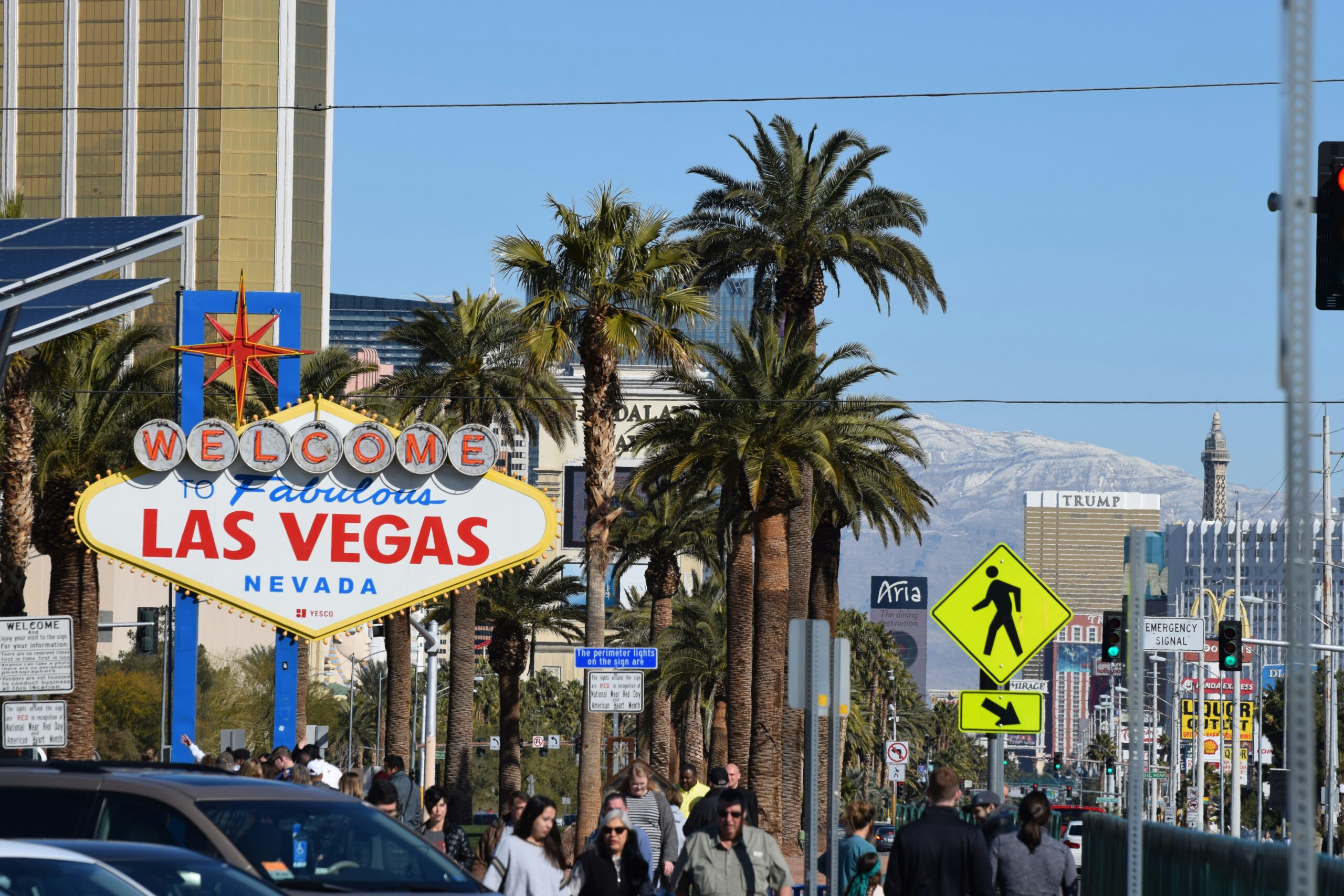 These hotels have mature themes that travelers will love.
pictured: a Las Vegas welcome sign on a bright blue day