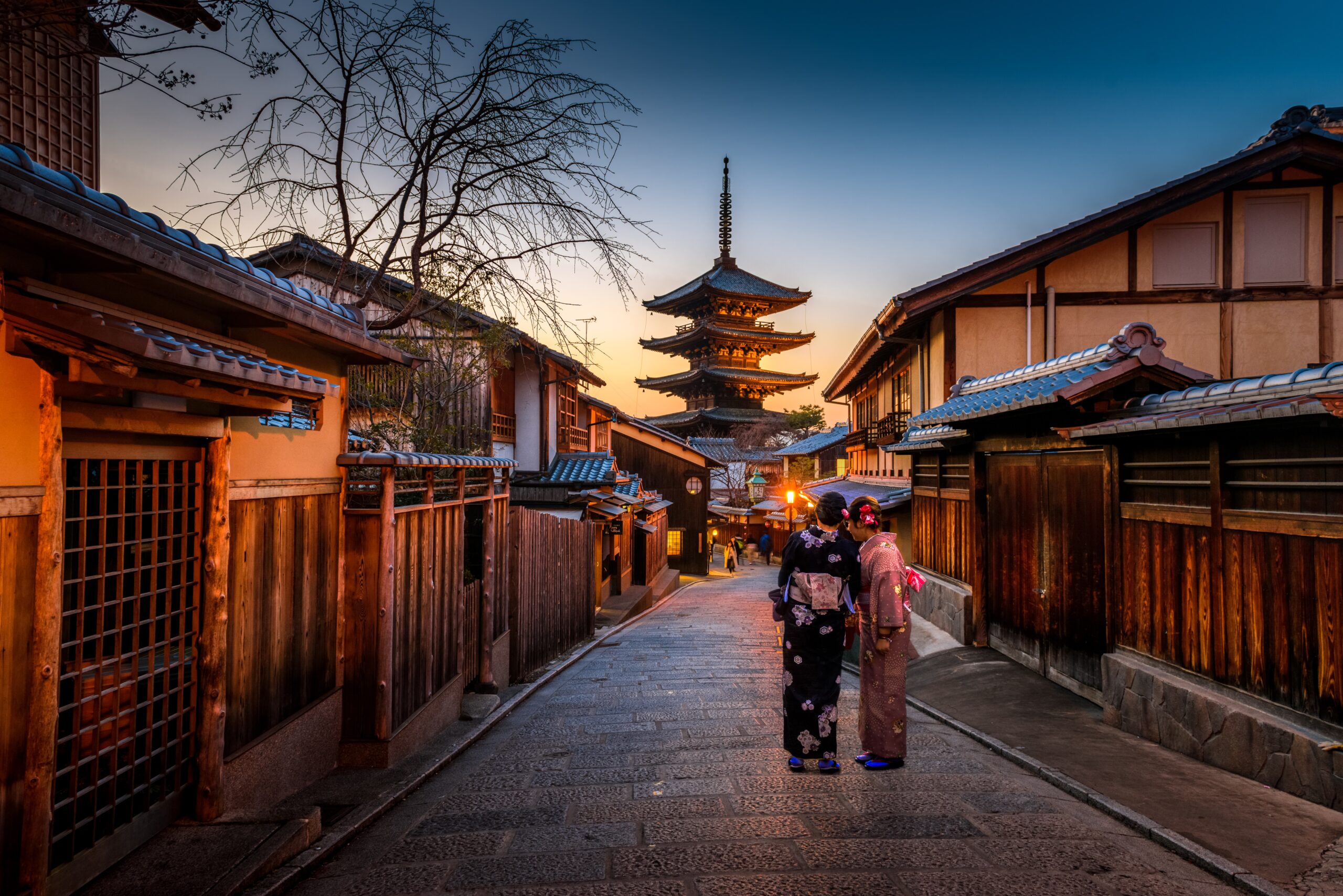 These luxury hotels in Kyoto are great for travelers trying to have relaxing and high end trips.
pictured: A temple of Kyoto with two women in traditional kimonos 