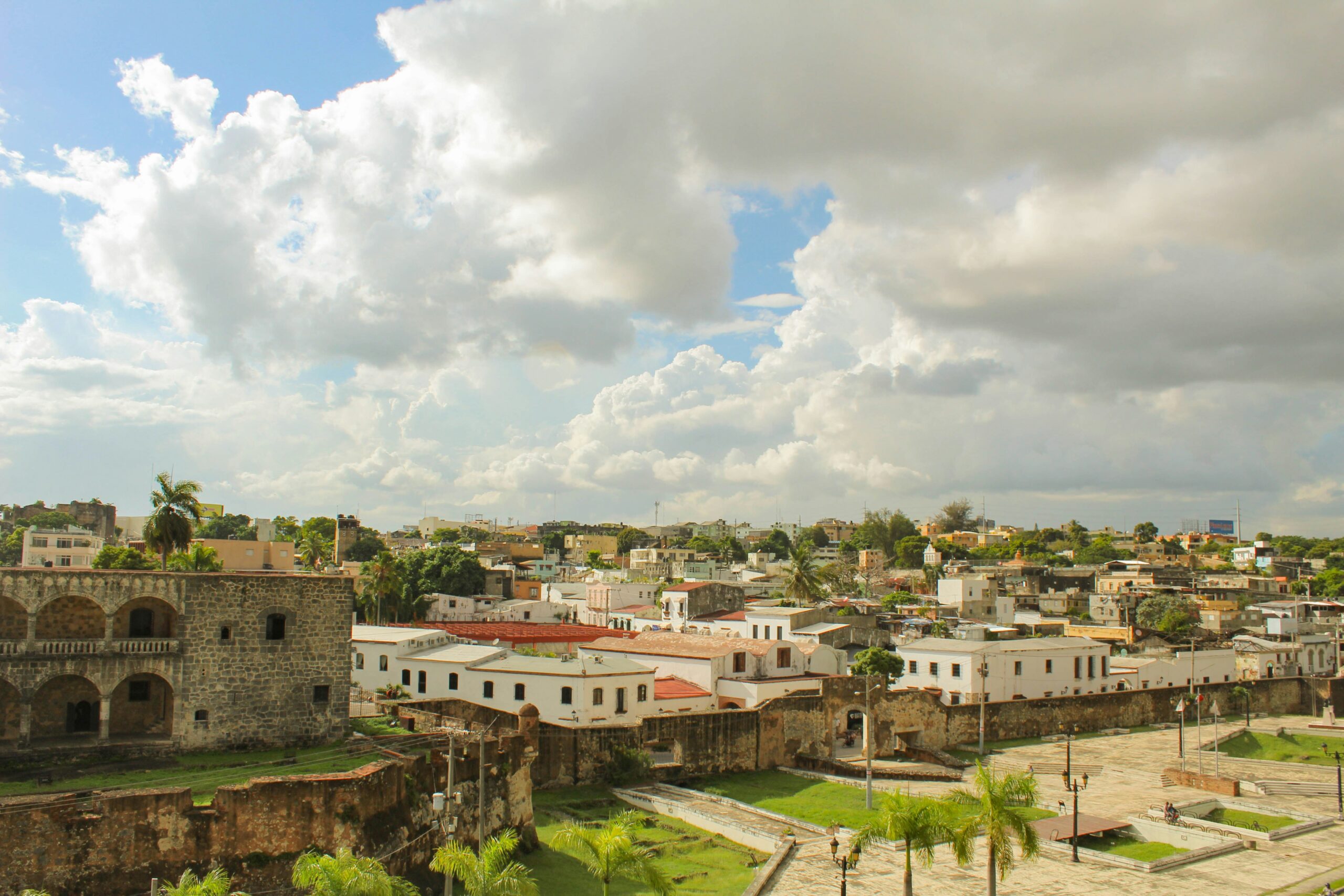 Learn more about the safety level of the Dominican Republic. 
pictured: a urban zone of the Dominican Republic on a cloudy day 