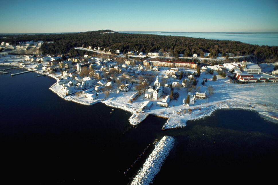 A waterfront town on Mackinac Island is covered with snow