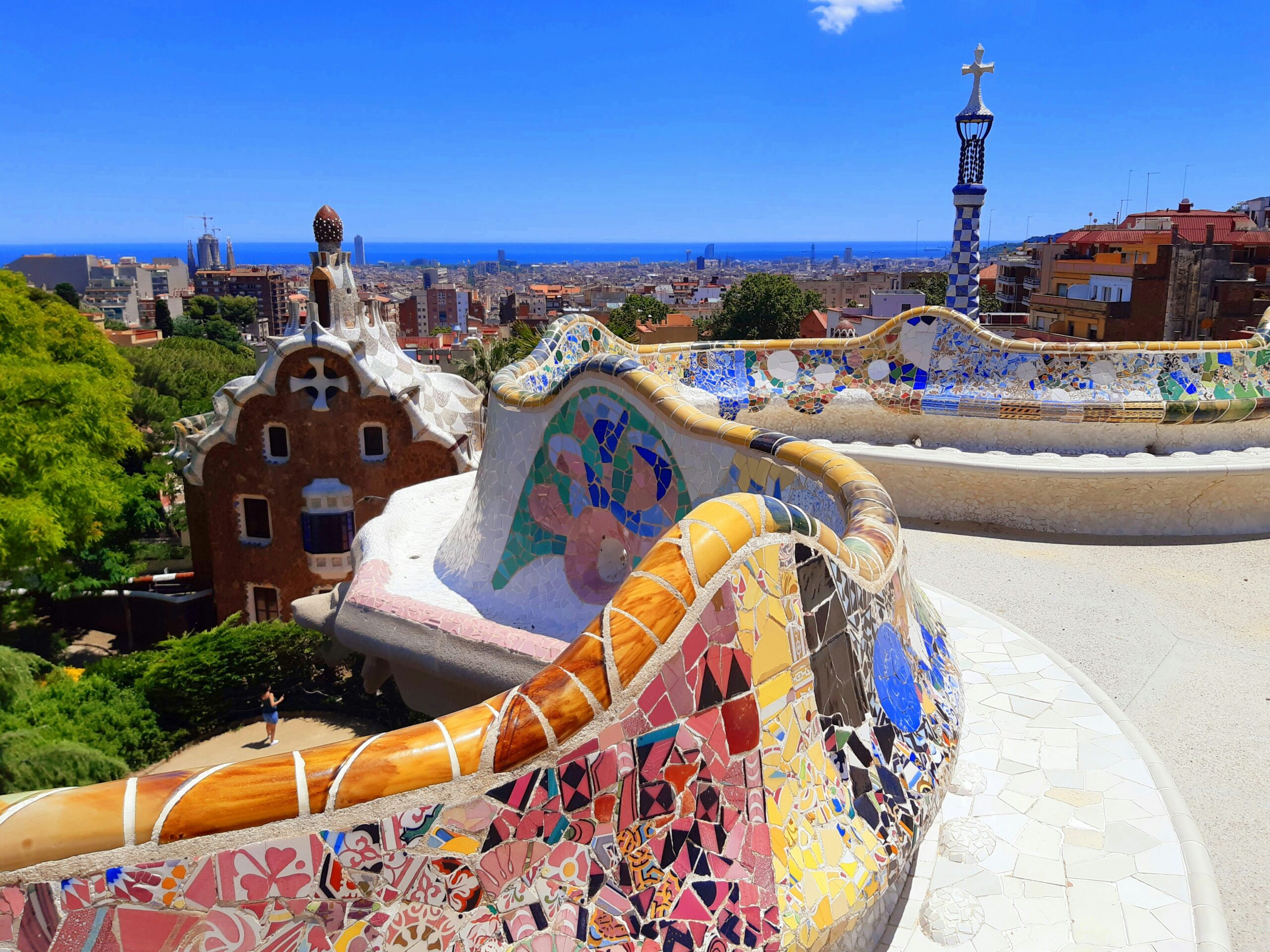 Barcelona is a historic city in Spain. It is one of the best cities to visit in Europe. 
Pictured: the vibrant walls of Barcelona overlooking the cityscape with lush greenery