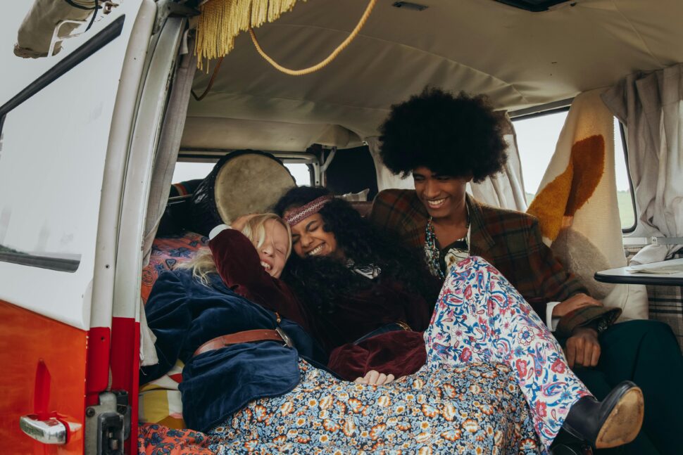 groups of friends in a van laughing