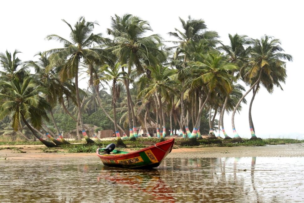 boat on the shore of a beach in Ada, Ghana