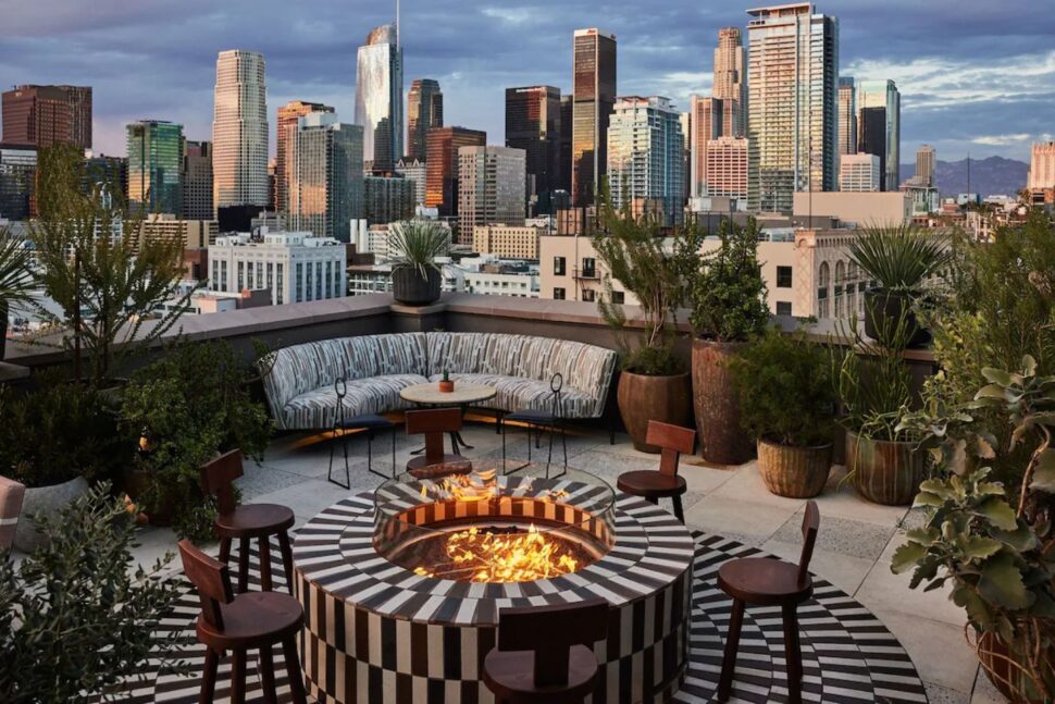 stunning sunset skyline view at firepit setting on the rooftop of Downtown Los Angeles Proper Hotel