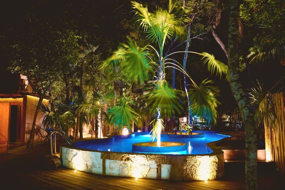 outdoor pool at night at Bufo Alvarius in Tulum Mexico