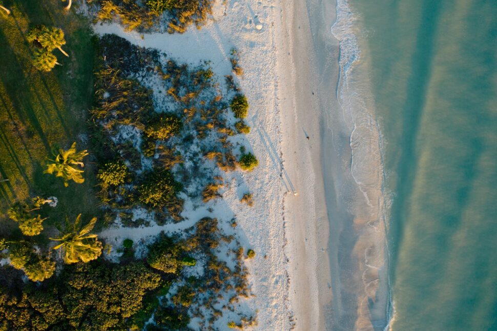 Aerial of people walking on the beach on Sanibel Captiva Island, Florida