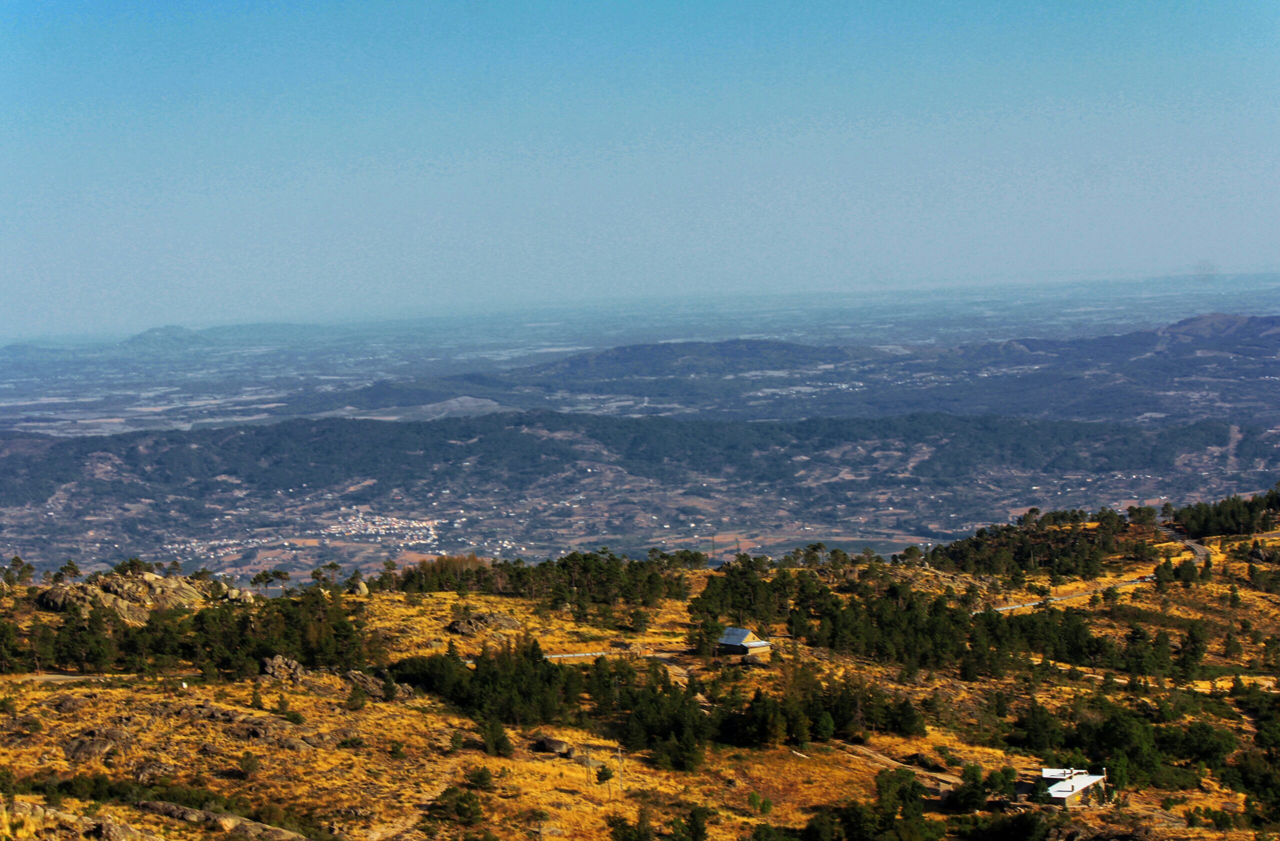 Learn more about the destinations in Portugal that brought the film "Damsel" to life. 
pictured: a view of the mountains in Serra de Estrela 
