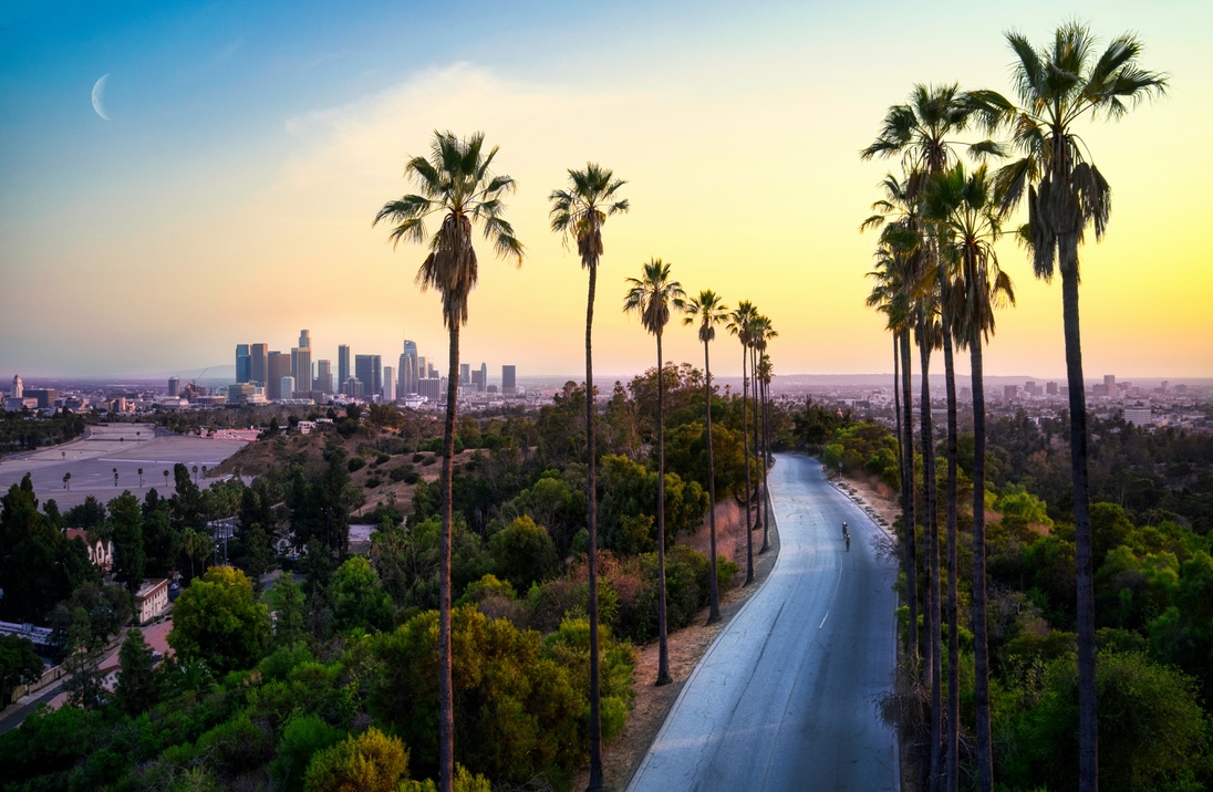 Learn why los Angeles is one of Rihanna's favorite places in the world. pictured: a sunset in LA overlooking greenery