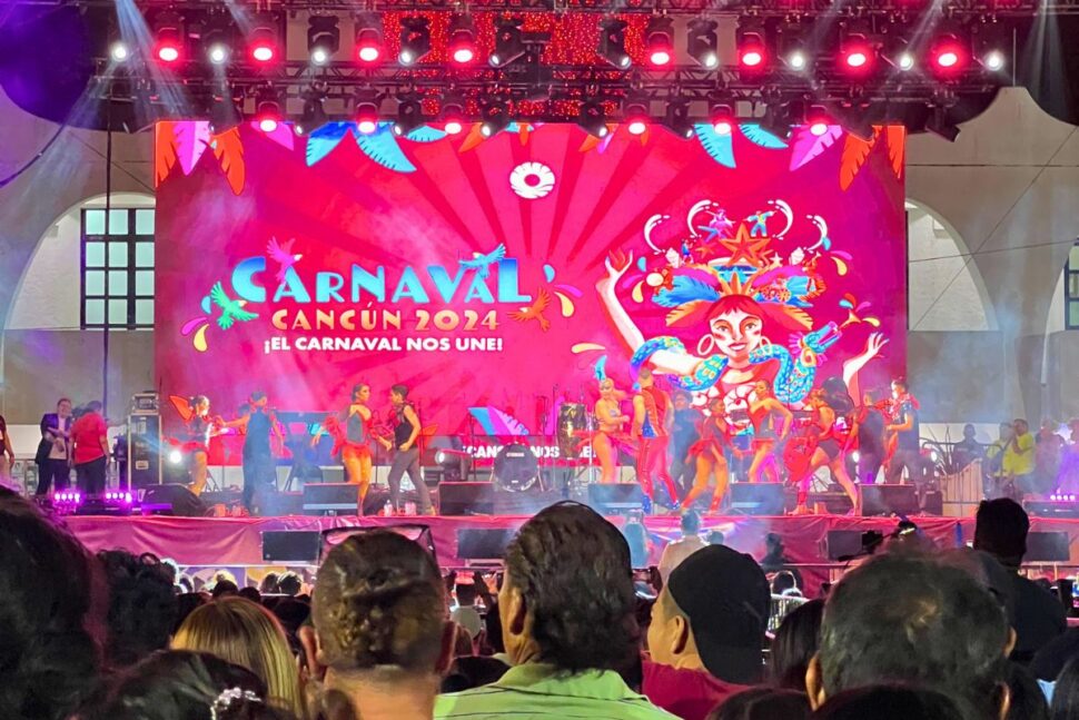 Cancun Carnaval stage with performers and crowd of people watching