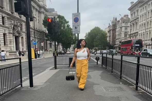 Shay Austin walking on a street in London