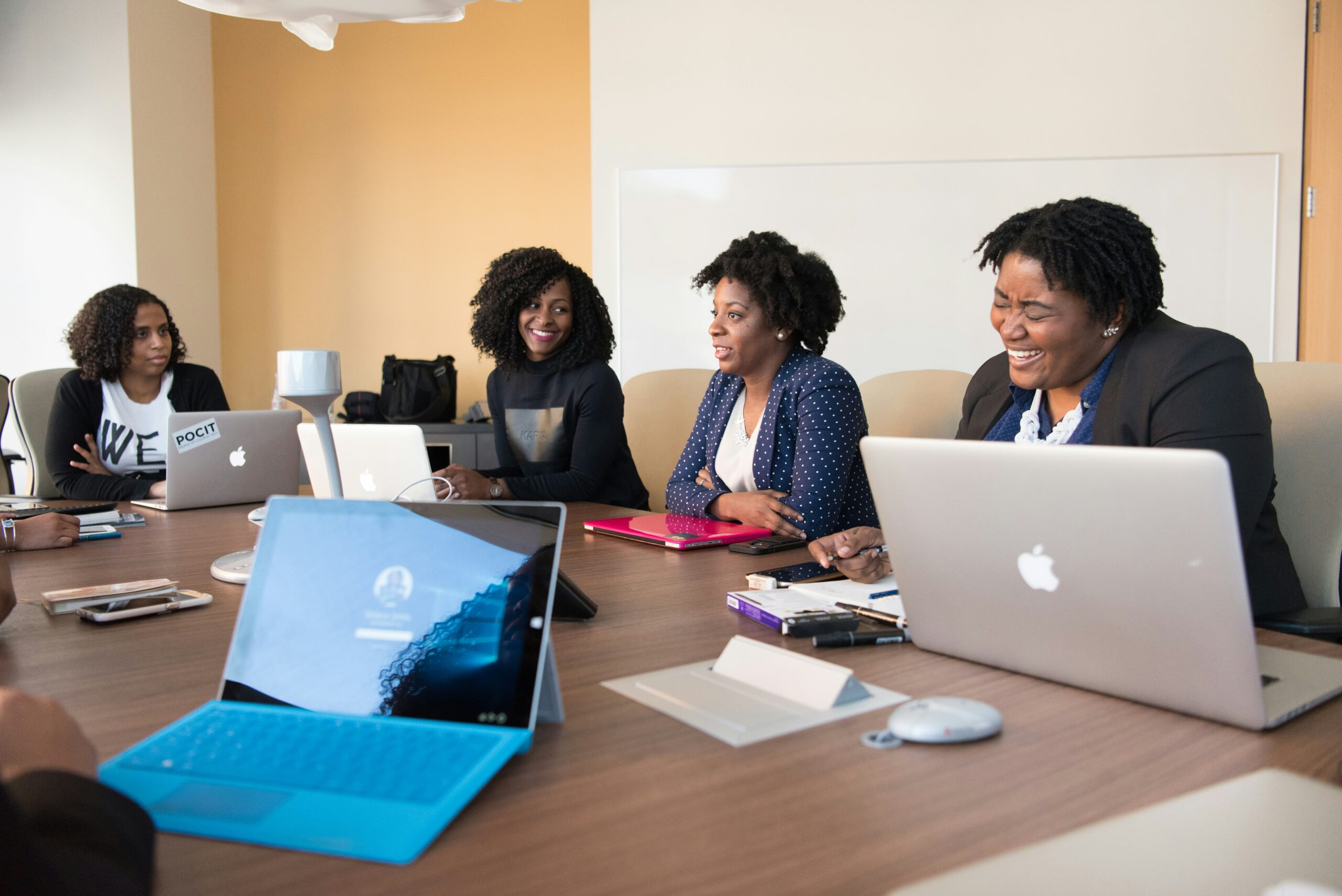 The New Orlean's Entrepreneur Week is a great festival for visitors in the city during March. 
pictured: Black business women seemingly conversing 