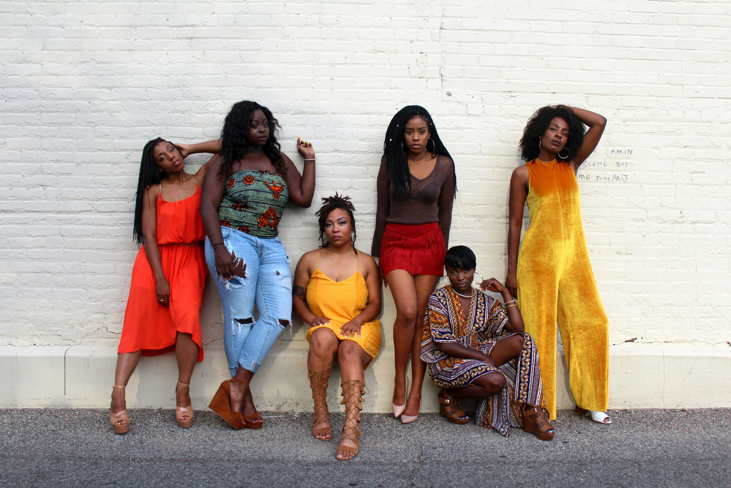 Women's History Month is a fun and informative time in New Orleans during one of the best times to visit. 
pictured: six Black women striking power poses