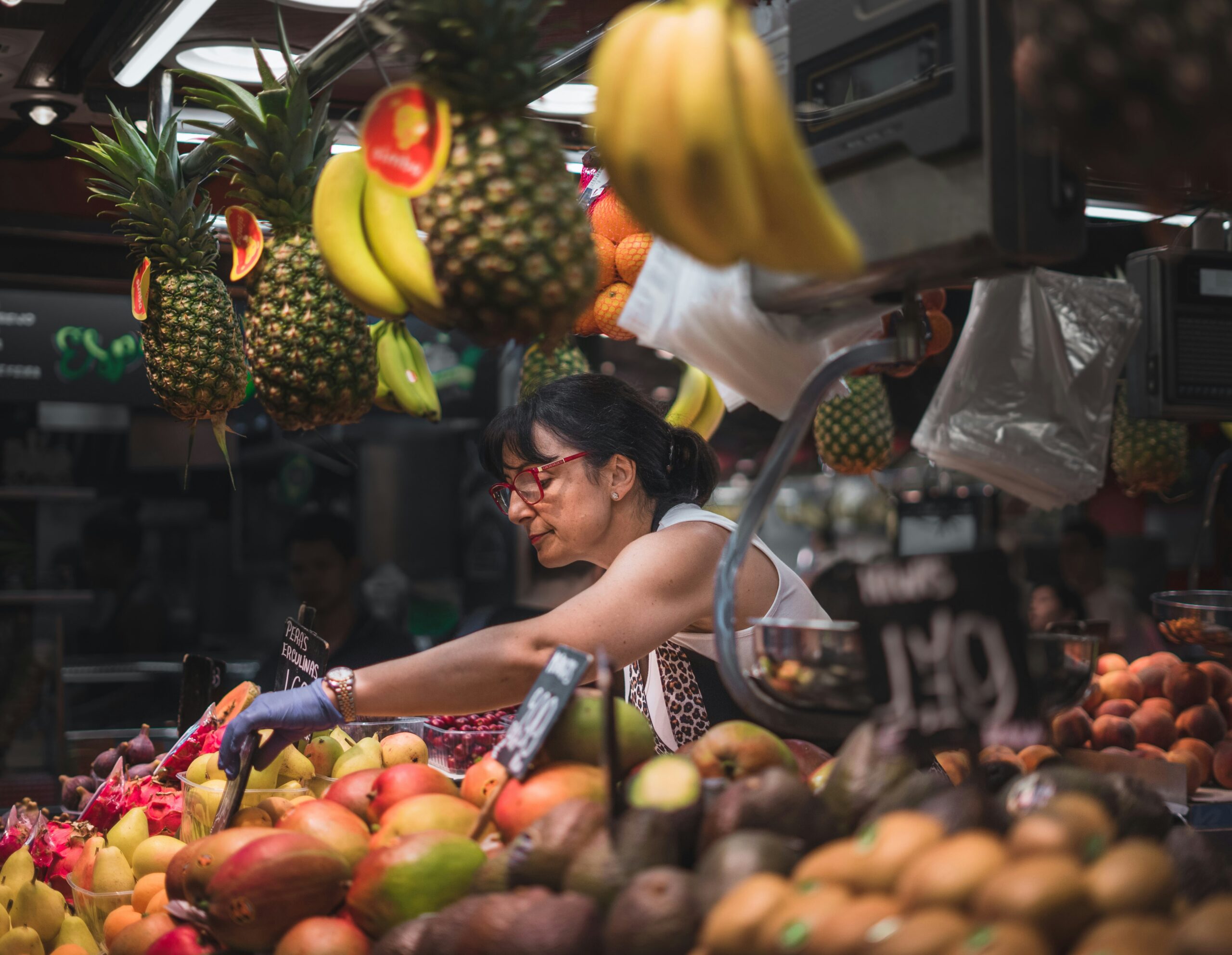 Learn more about the culinary world of Costa Rica. 
pictured: a woman selling fruit at a market 
