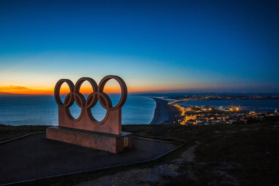 Olympic rings statue on a hilltop