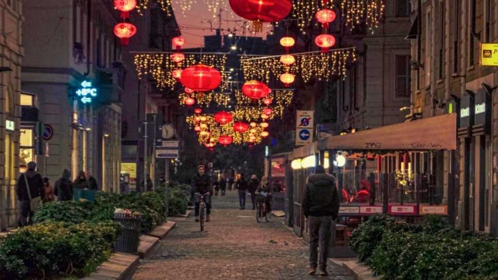 People walking along via Paolo Sarpi in Milan's Chinatown