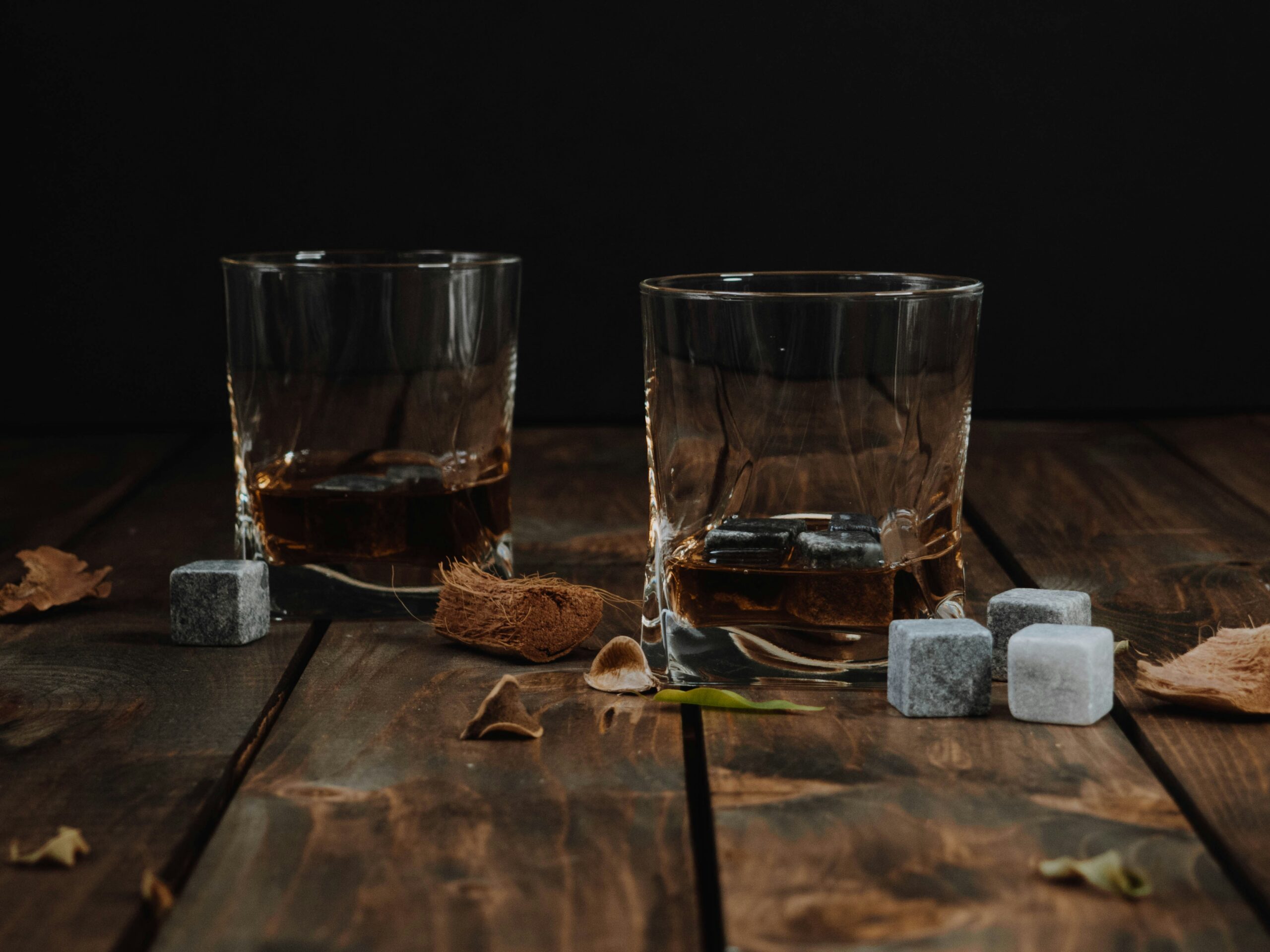 This whiskey distillery offers travelers unique experiences.
pictured: two glasses of whiskey with ice cubes 
