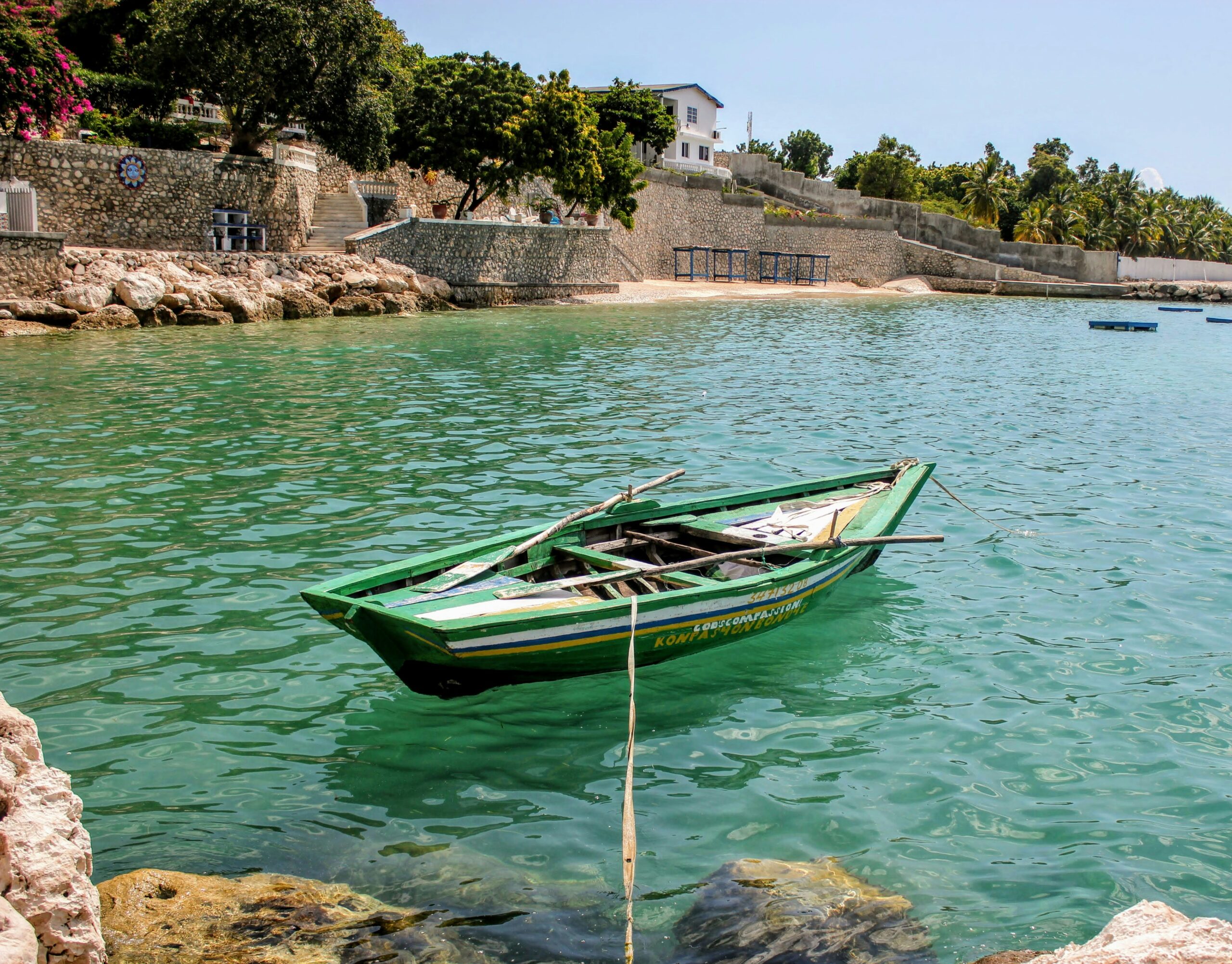 Learn how a new leader being sworn in will impact Haiti. pictured: a small boat off the coast of Haiti