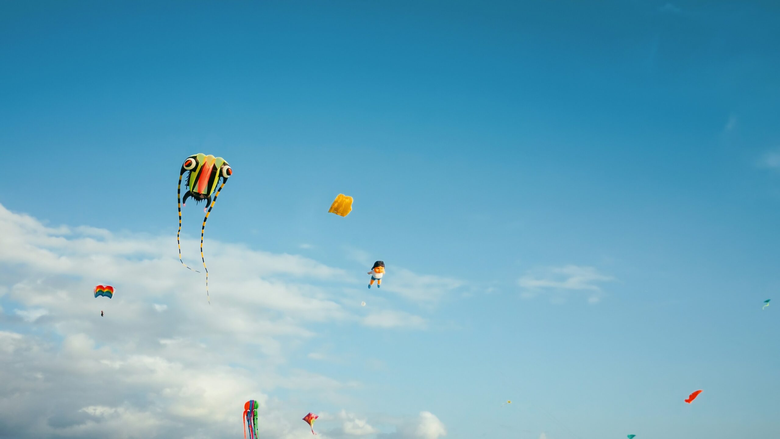There are some festivals in Antigua during the dry season. 
Pictured: kites on bright cloudy day