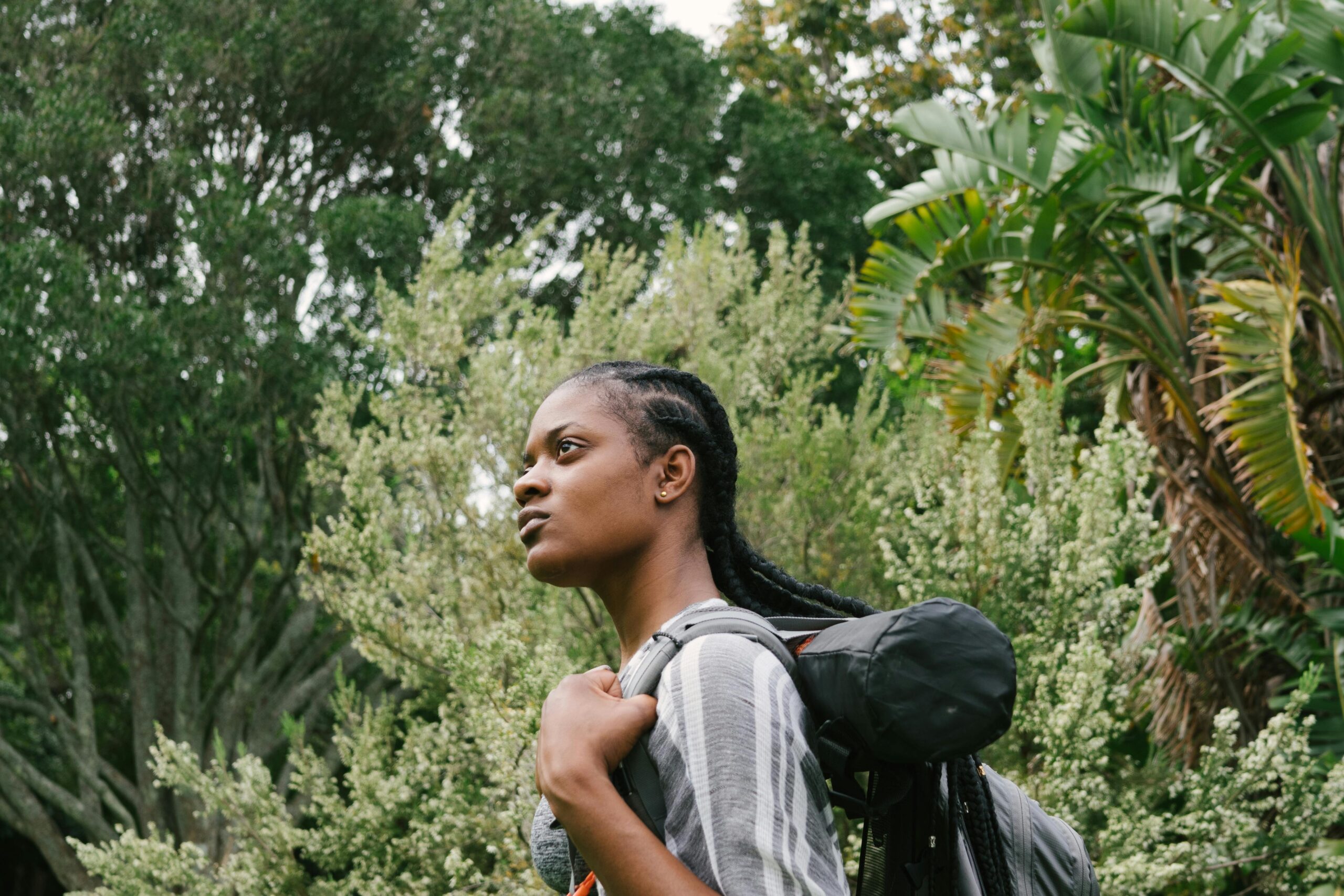 Learn more about the study that looks into the safety of women solo travelers. 
pictured: a Black woman backpacking by herself 