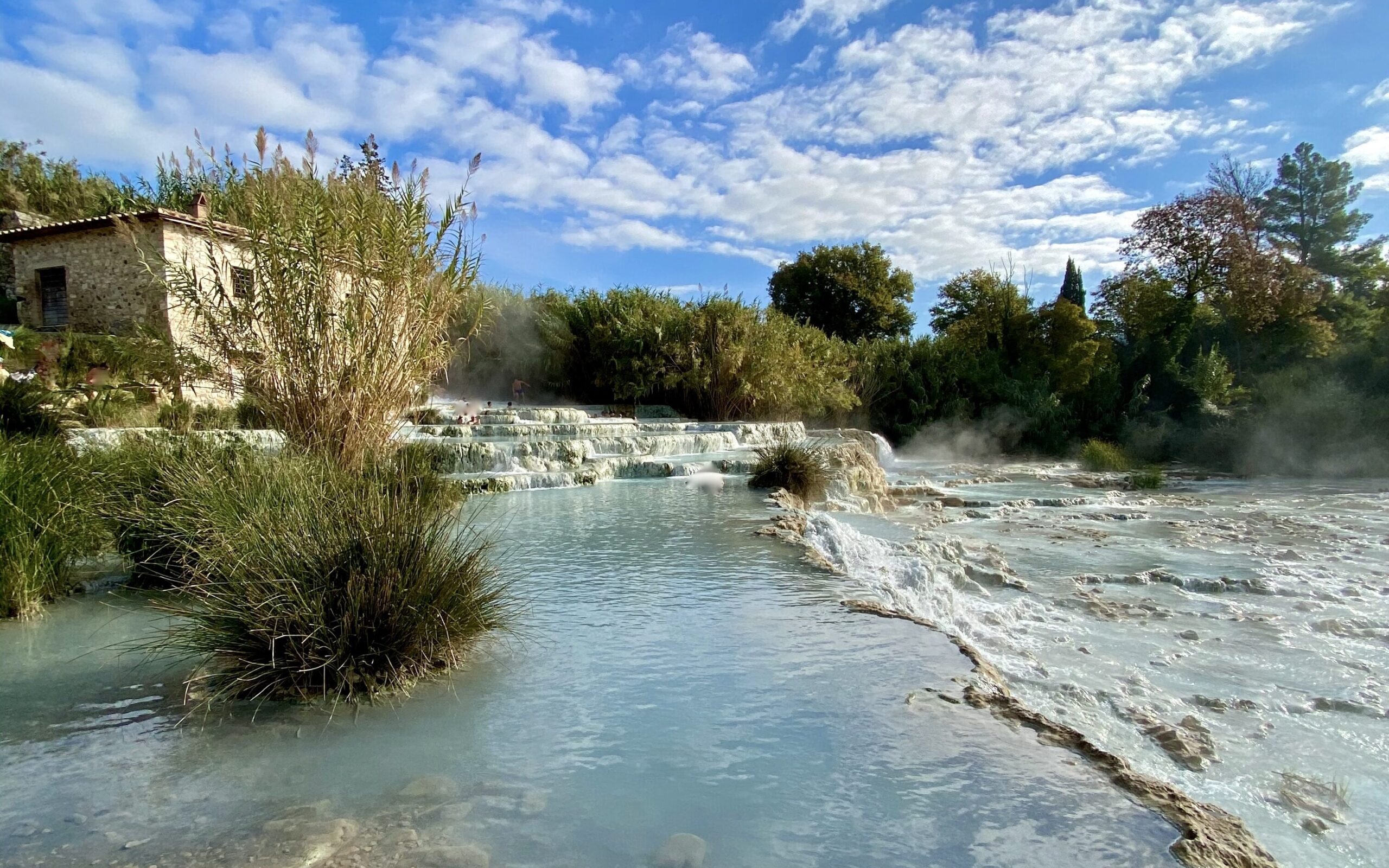 day trips from florence Pictured: a close up of the Saturnia hot spring