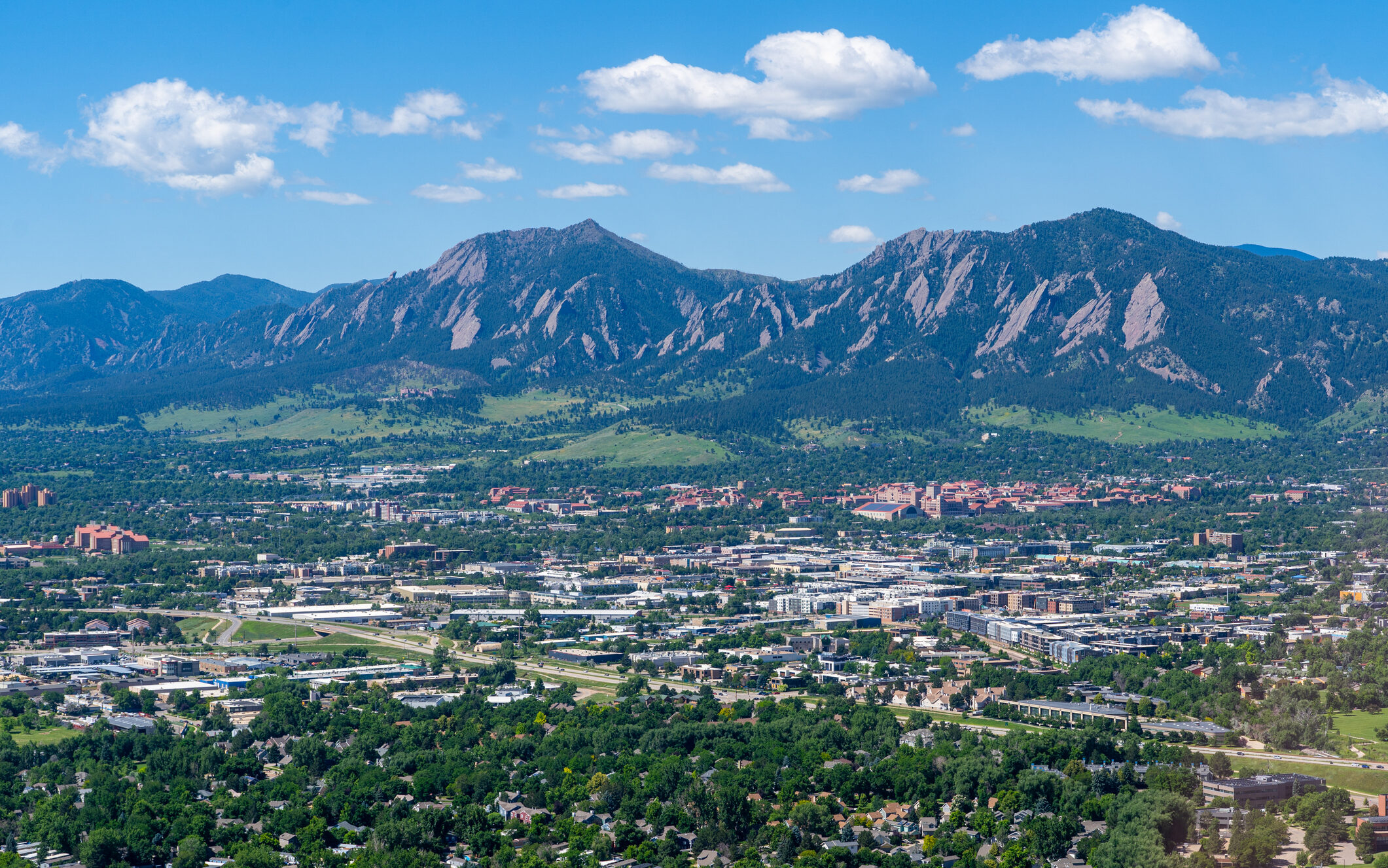 Aerial View above Boulder Colorado looking southwest towards University of Colorado and Flatiron Mountains